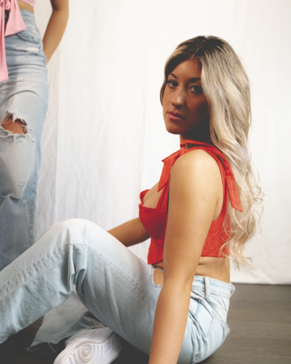 Woman styling white jeans in daylight