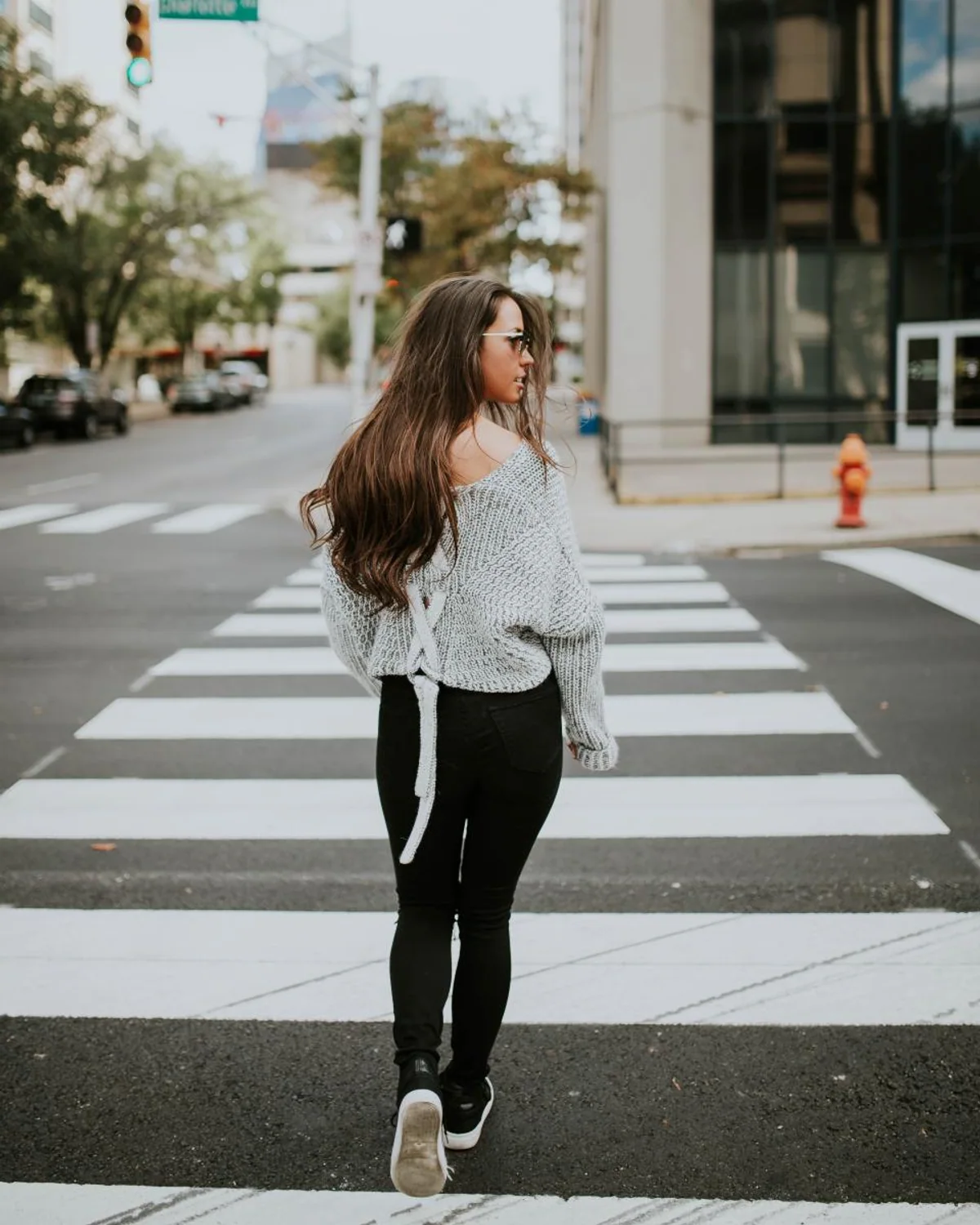 Woman exploring a European city in a travel outfit