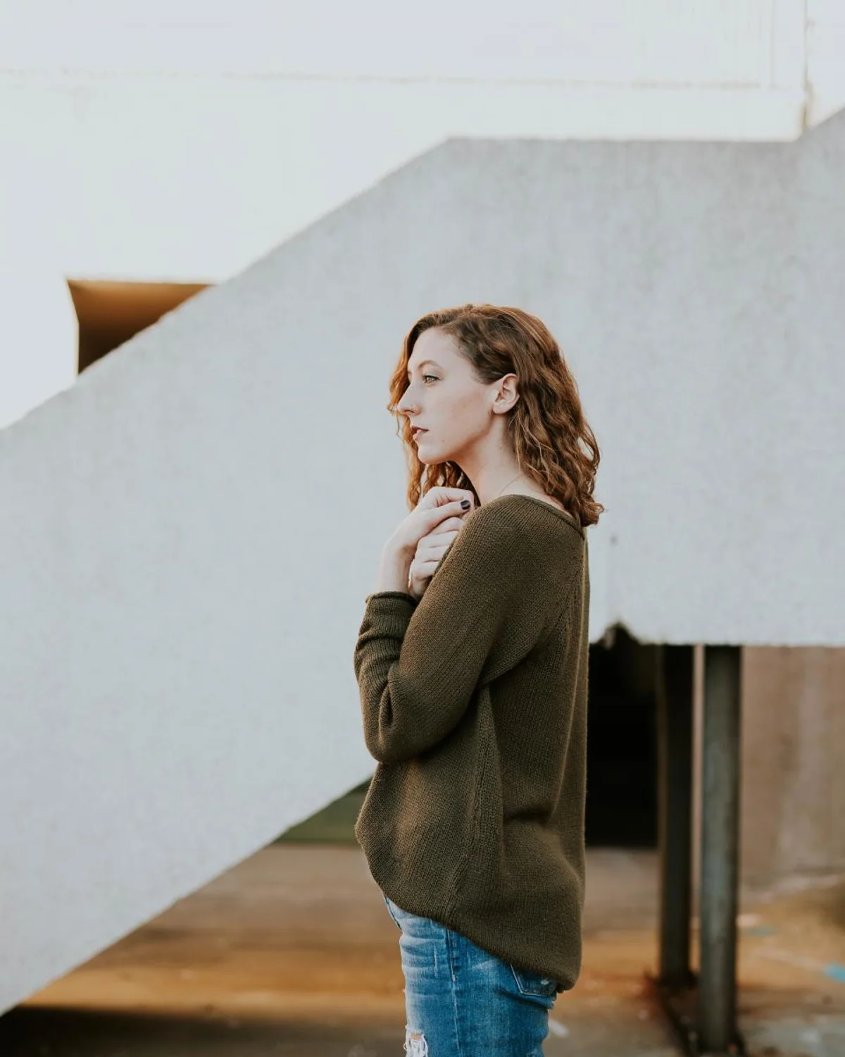 Woman comparing denim choices at home